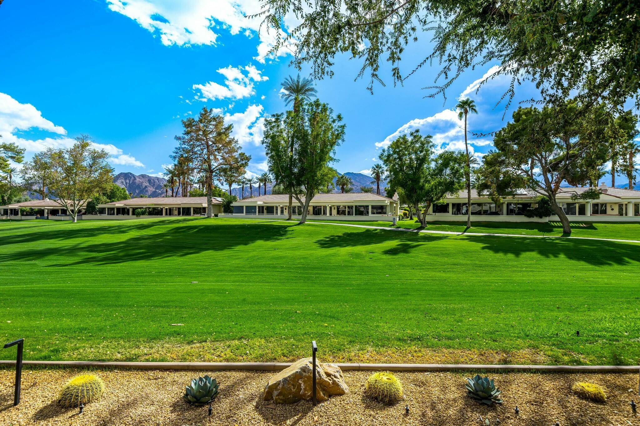 75405 Riviera Drive Indian Wells, CA 92210 - Photo 41 of 43 a front view of a house with garden
