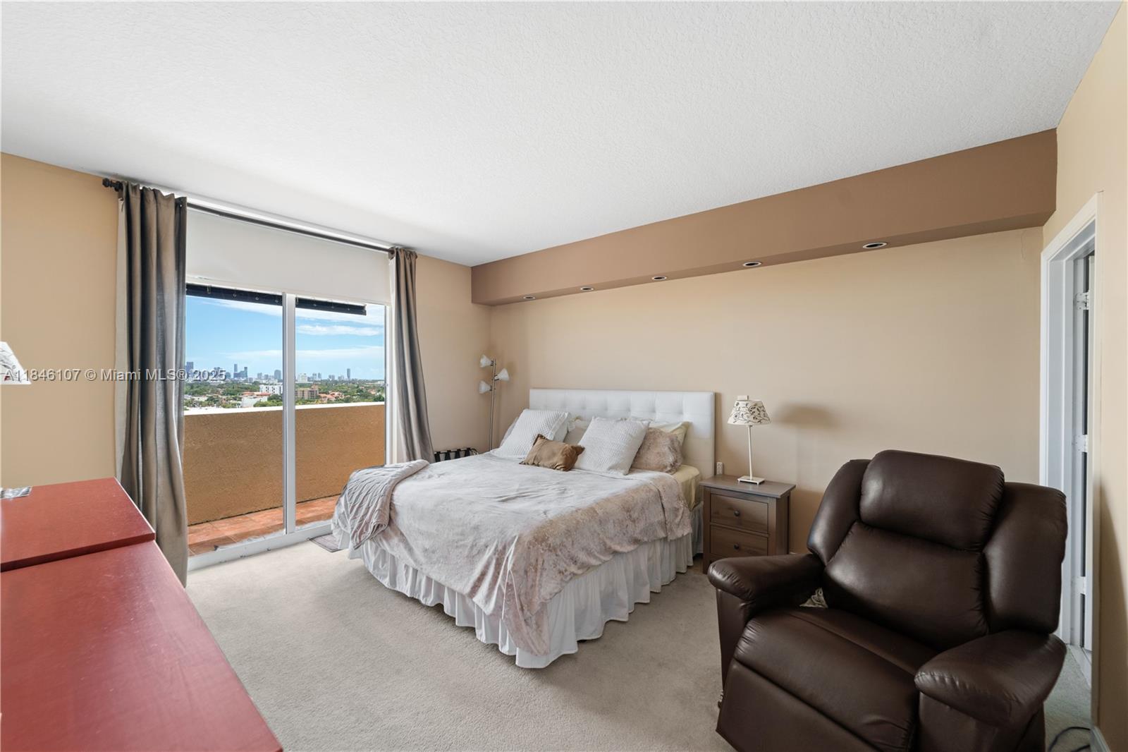 117 Northwest 42nd Avenue, Unit 1611 Miami, FL 33126 - Photo 15 of 20 a bedroom with a bed couch and window