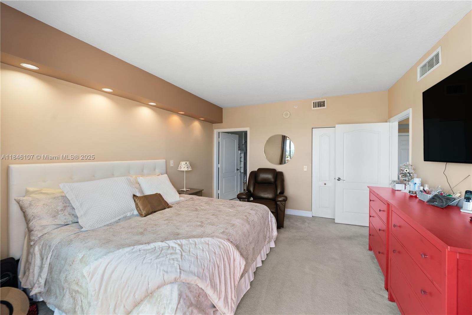 117 Northwest 42nd Avenue, Unit 1611 Miami, FL 33126 - Photo 16 of 20 a bedroom with a bed and a flat screen tv