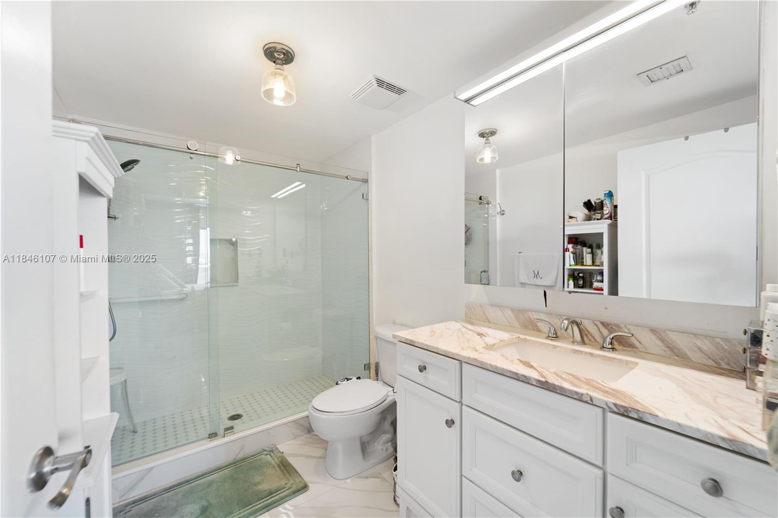 117 Northwest 42nd Avenue, Unit 1611 Miami, FL 33126 - Photo 19 of 20 a bathroom with a granite countertop sink a toilet and shower