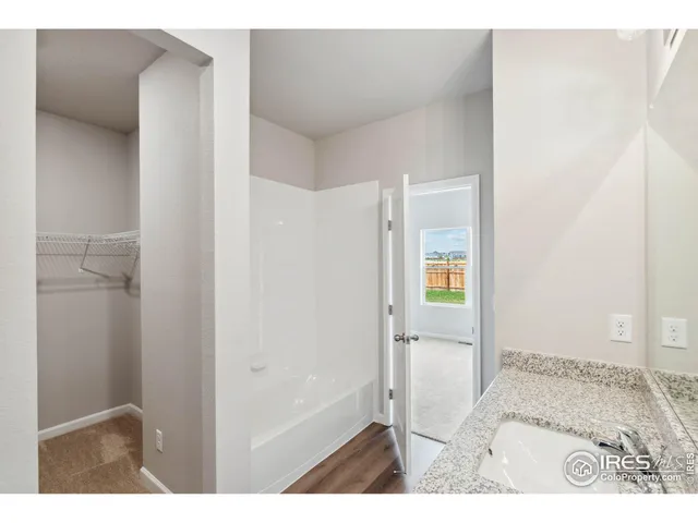 a bathroom with a bathtub and a sink