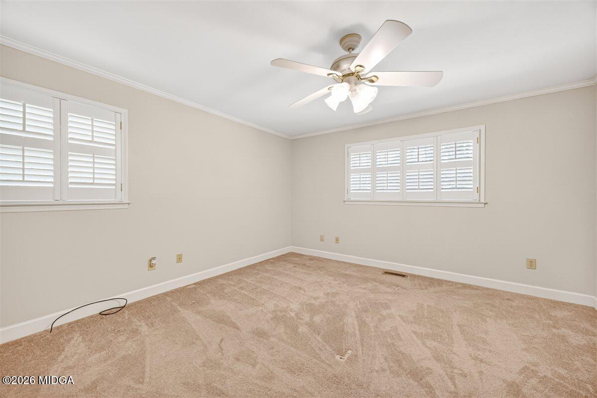 335 Hamrick Road Macon, GA 31220 - Photo 14 of 41 an empty room with windows and chandelier fan