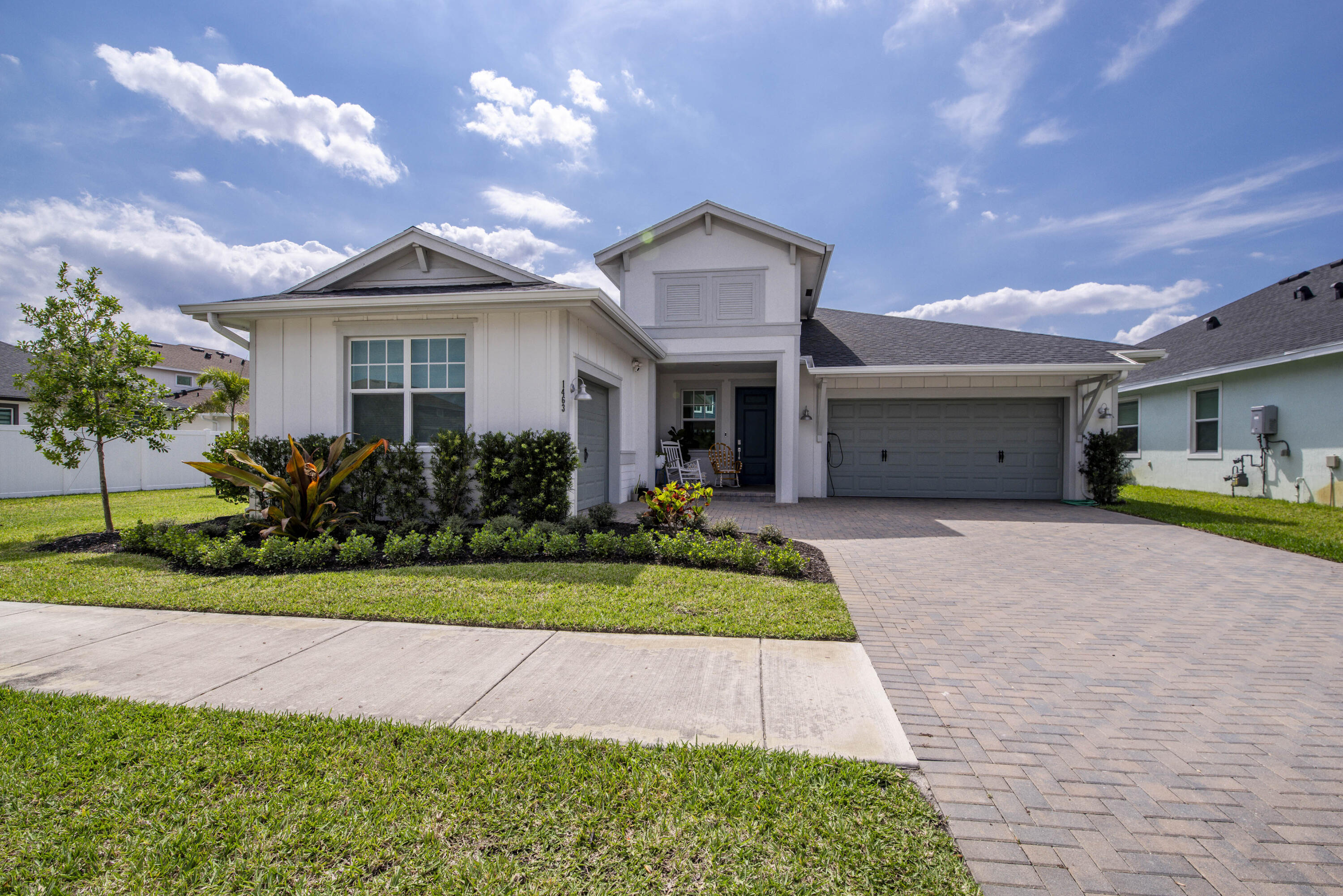 1463 Heron Nook Road Loxahatchee, FL 33470 - Photo 1 of 87 a front view of a house with a garden and plants