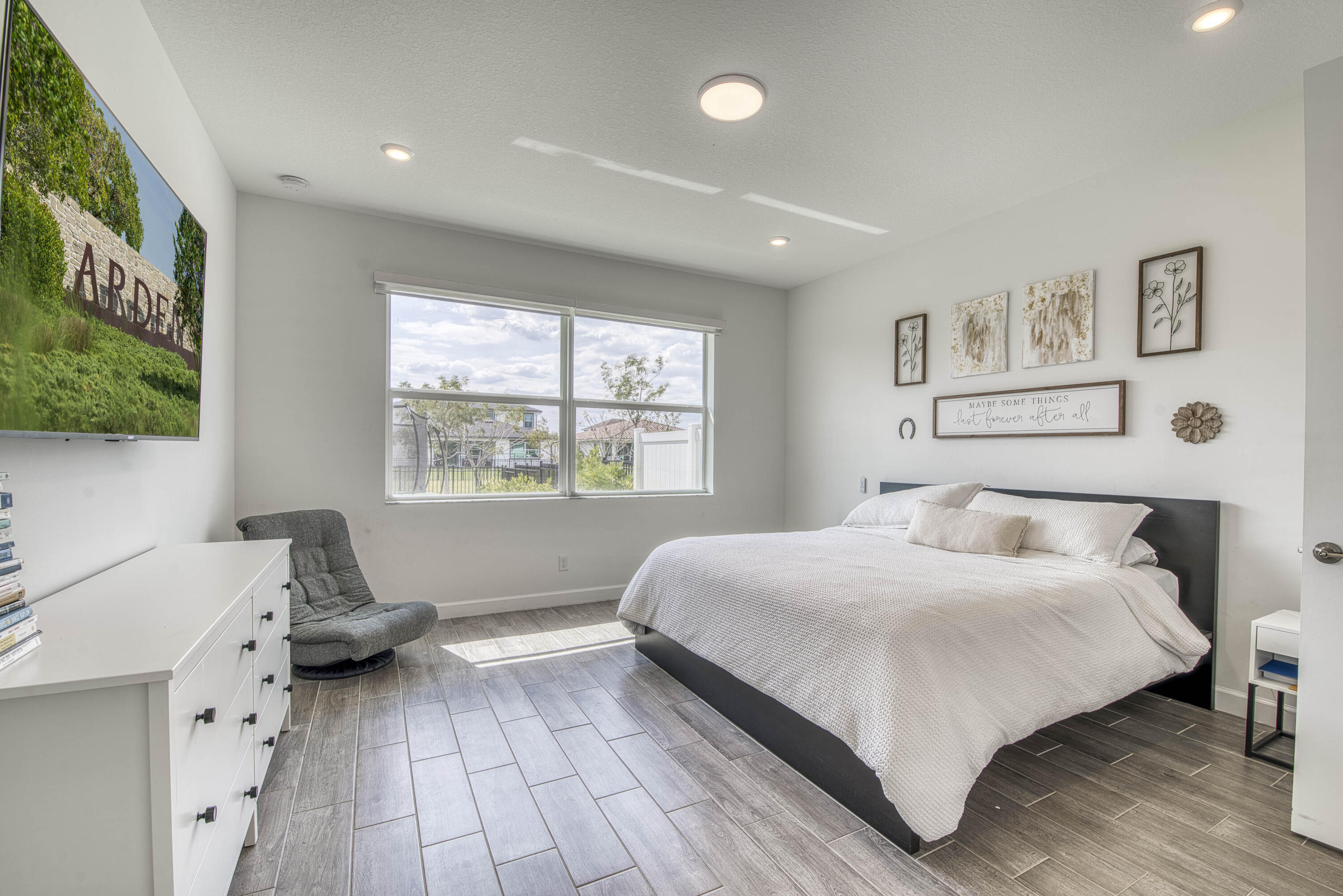 1463 Heron Nook Road Loxahatchee, FL 33470 - Photo 14 of 87 a bedroom with a bed and a large window