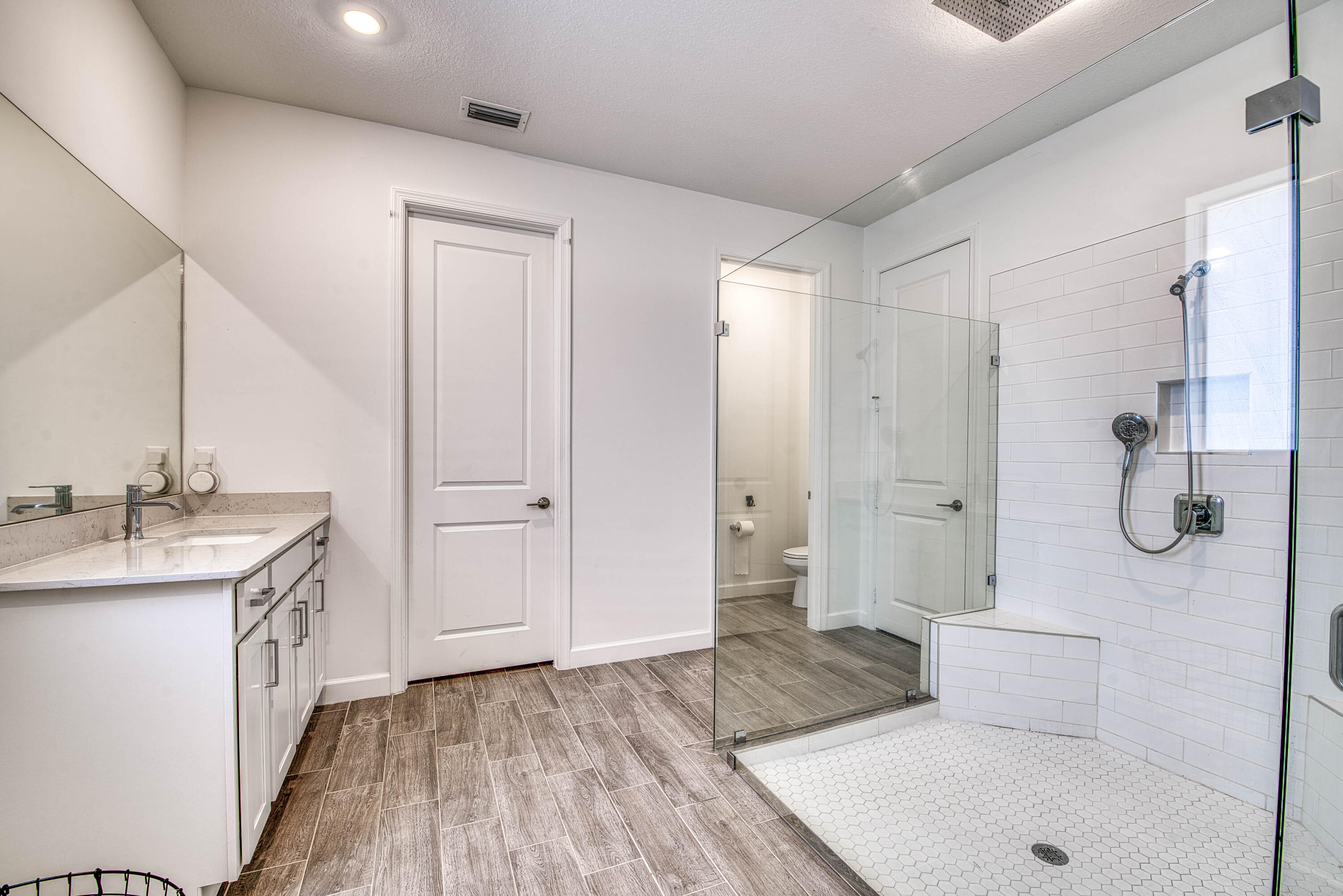 1463 Heron Nook Road Loxahatchee, FL 33470 - Photo 18 of 87 a bathroom with a sink and a mirror