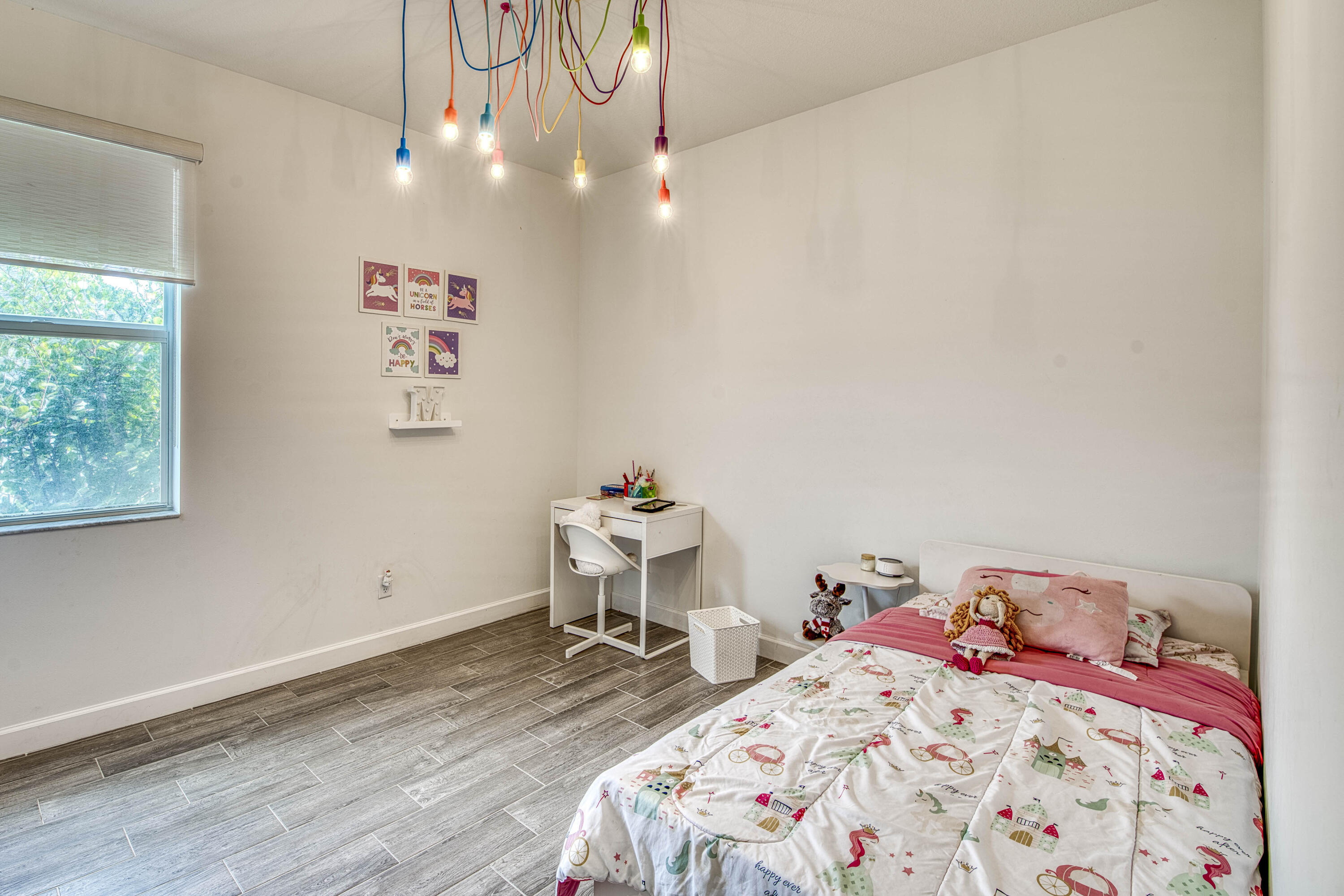 1463 Heron Nook Road Loxahatchee, FL 33470 - Photo 20 of 87 a bedroom with a bed and a table in it