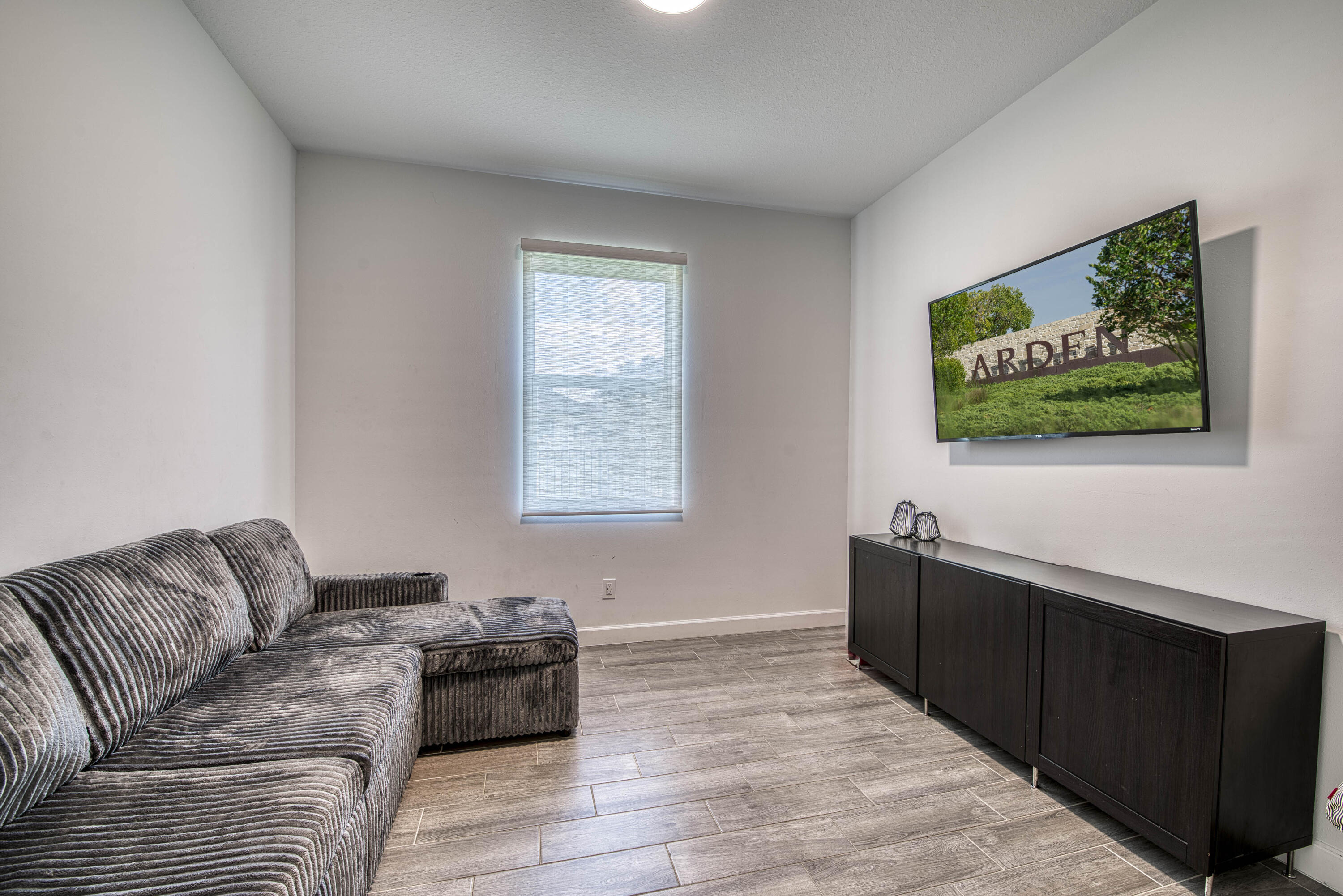 1463 Heron Nook Road Loxahatchee, FL 33470 - Photo 25 of 87 a living room with furniture and a flat screen tv