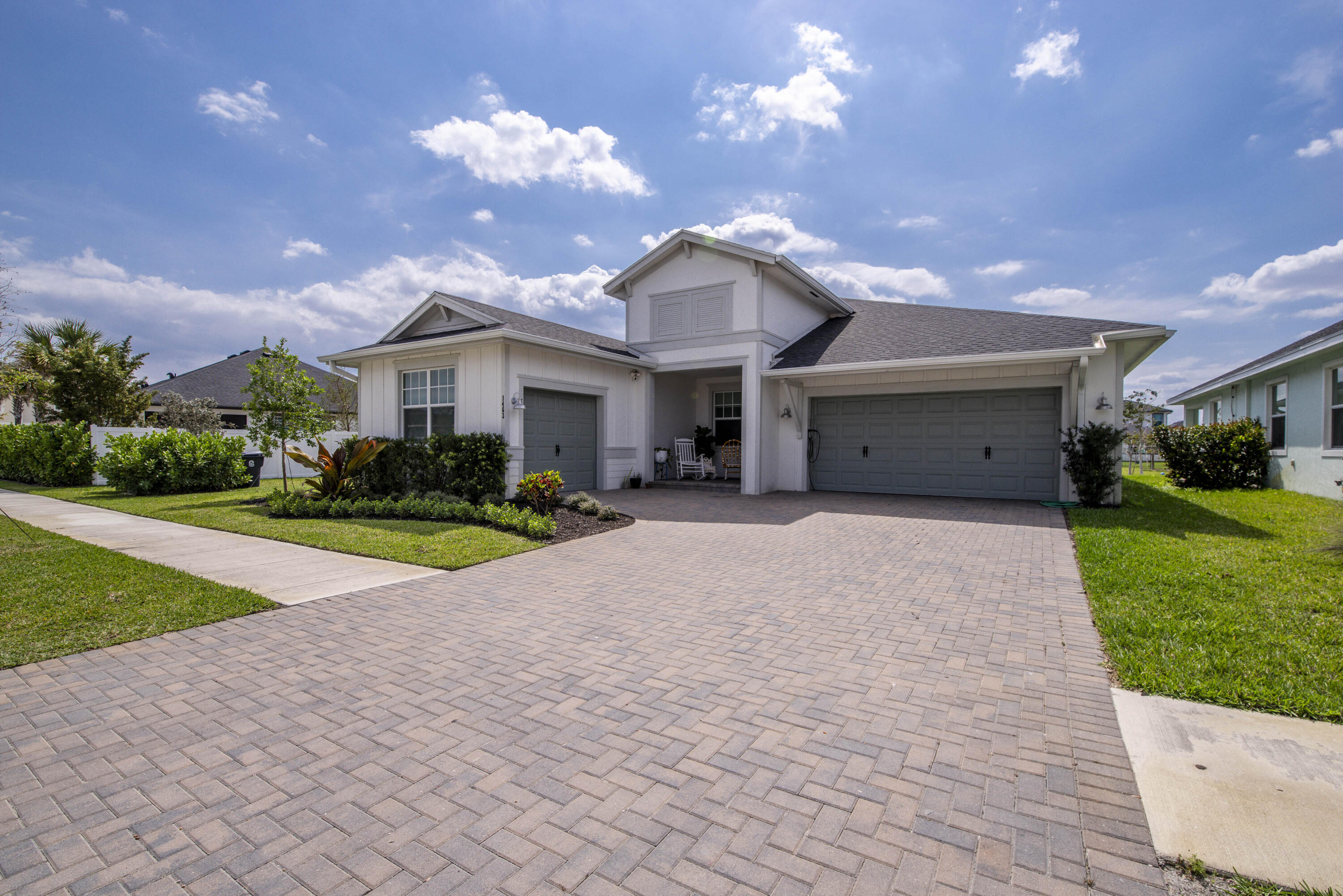 1463 Heron Nook Road Loxahatchee, FL 33470 - Photo 29 of 87 a view of a house with a yard and plants