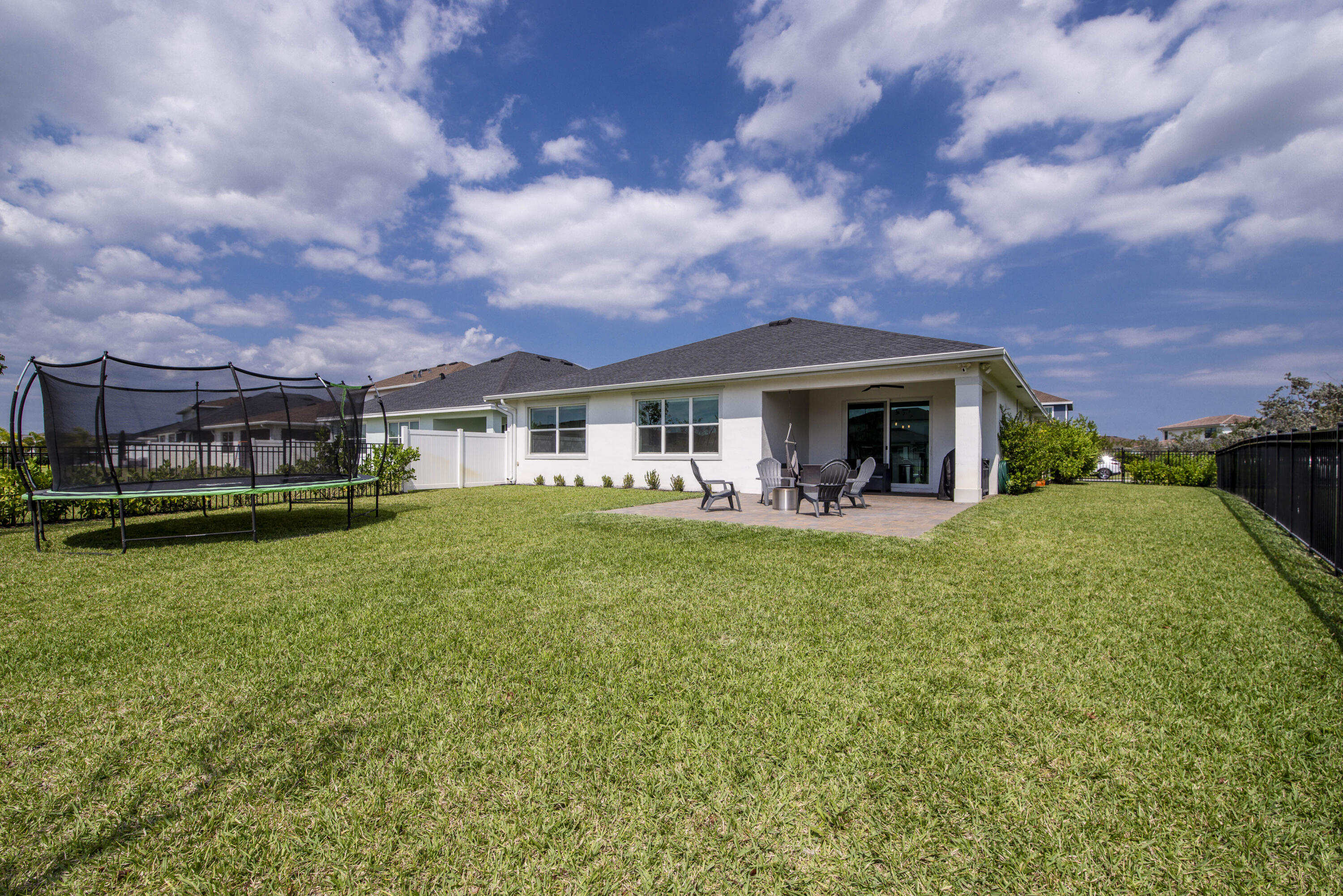 1463 Heron Nook Road Loxahatchee, FL 33470 - Photo 31 of 87 a view of a house with a backyard
