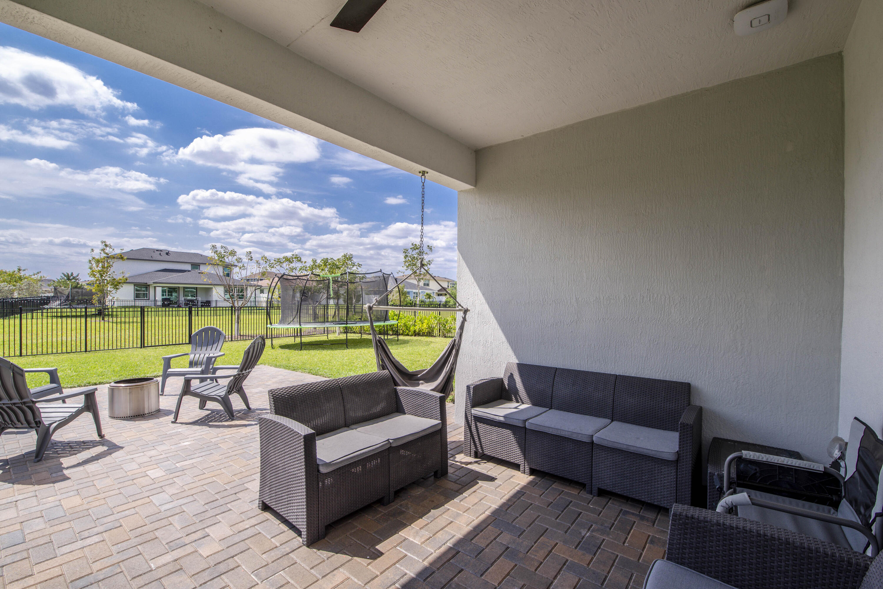 1463 Heron Nook Road Loxahatchee, FL 33470 - Photo 36 of 87 a living room with furniture and a flat screen tv