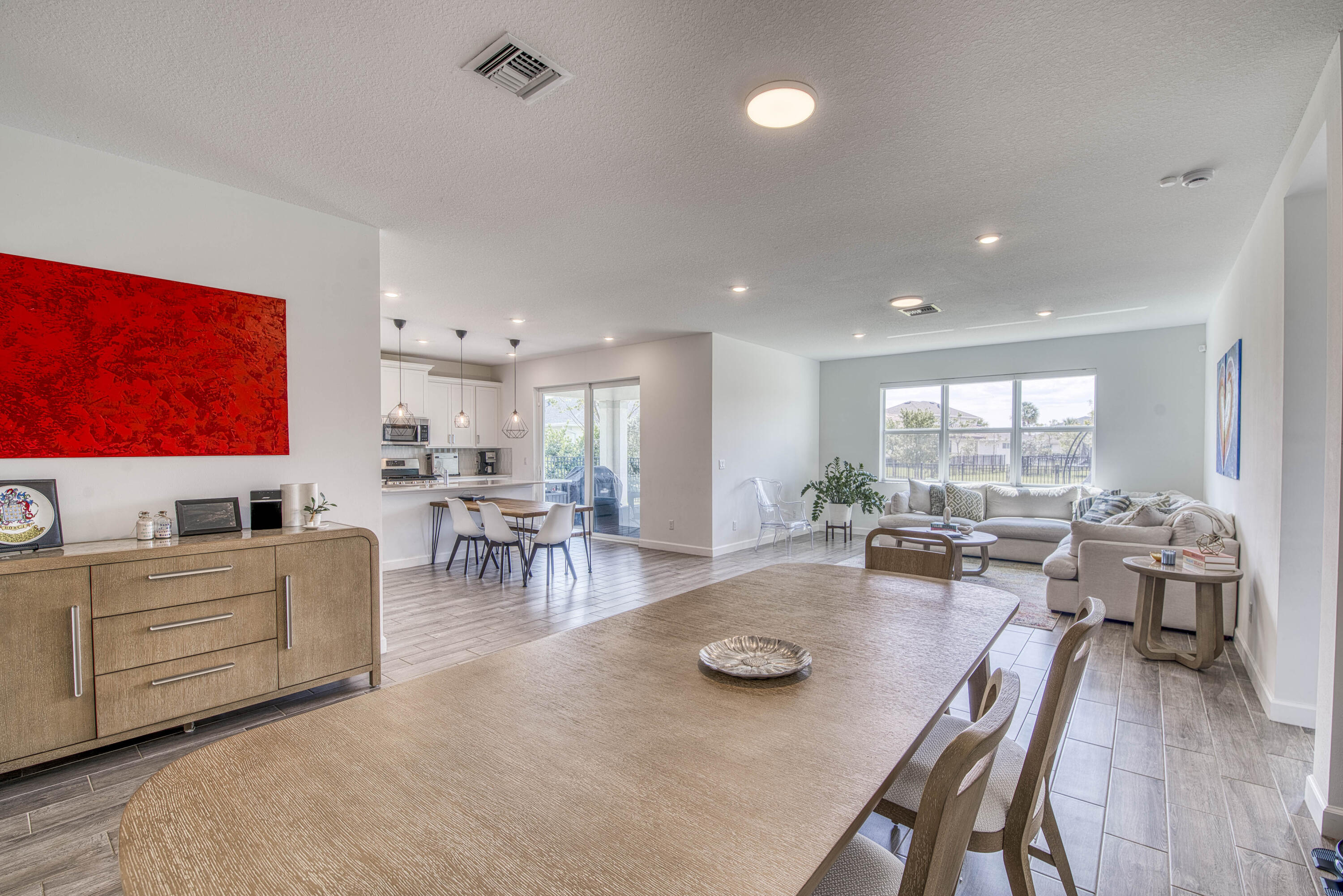 1463 Heron Nook Road Loxahatchee, FL 33470 - Photo 4 of 87 a view of a dining room with furniture window and outside view