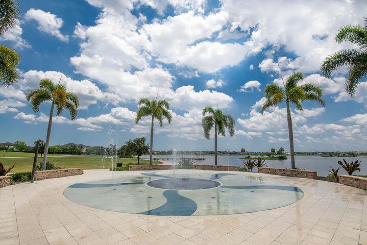 1463 Heron Nook Road Loxahatchee, FL 33470 - Photo 59 of 87 a view of a swimming pool and outdoor space