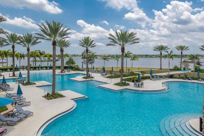 1463 Heron Nook Road Loxahatchee, FL 33470 - Photo 63 of 87 a view of swimming pool with outdoor seating and city view