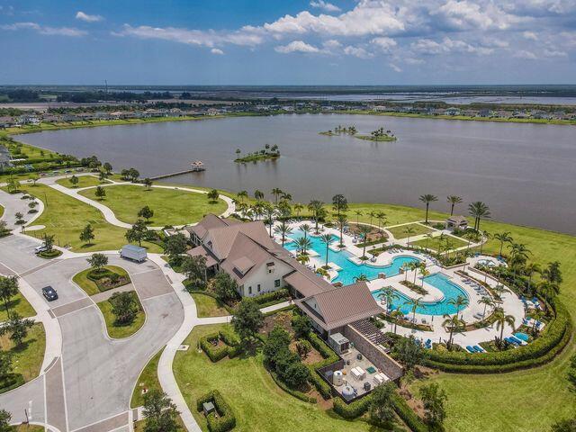 1463 Heron Nook Road Loxahatchee, FL 33470 - Photo 69 of 87 an aerial view of a house with a lake view