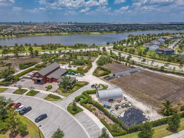1463 Heron Nook Road Loxahatchee, FL 33470 - Photo 71 of 87 an aerial view of residential houses with outdoor space and river