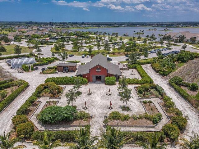 1463 Heron Nook Road Loxahatchee, FL 33470 - Photo 73 of 87 an aerial view of residential houses with outdoor space