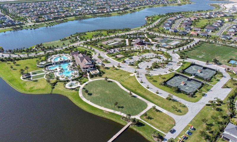 1463 Heron Nook Road Loxahatchee, FL 33470 - Photo 74 of 87 an aerial view of a house with a lake view