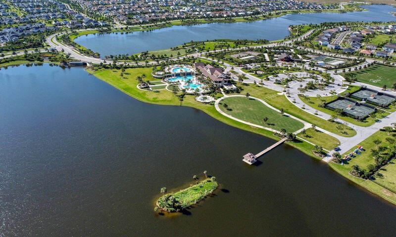 1463 Heron Nook Road Loxahatchee, FL 33470 - Photo 75 of 87 an aerial view of a house with a lake view