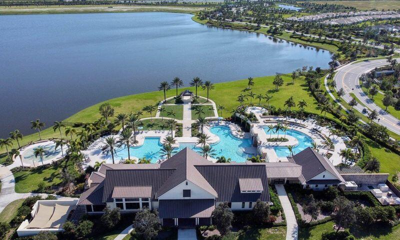 1463 Heron Nook Road Loxahatchee, FL 33470 - Photo 78 of 87 an aerial view of a house with a yard and lake view