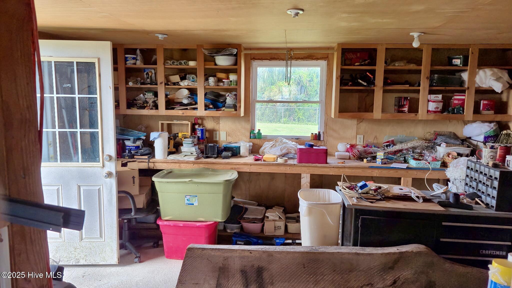 198 Mary Ella Road Harkers Island, NC 28531 - Photo 38 of 44 Shed workshop with storage