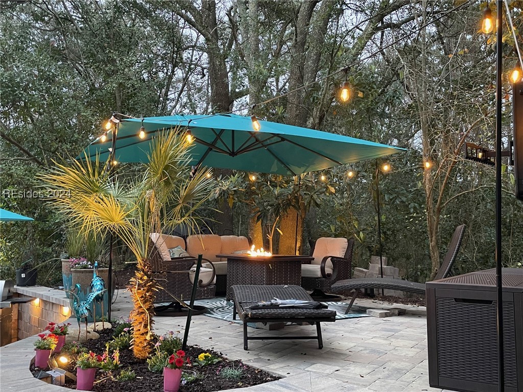 43B Jenkins Island Road Hilton Head Island, SC 29926 - Photo 3 of 19 View of patio featuring cooling unit and an outdoor living space with a fire pit