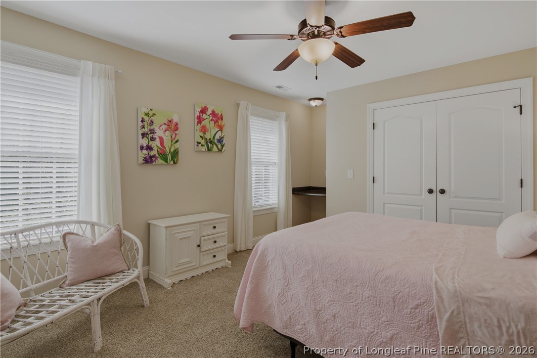 14 Spring Water Court Spring Lake, NC 28390 - Photo 18 of 34 a spacious bedroom with a bed and a window