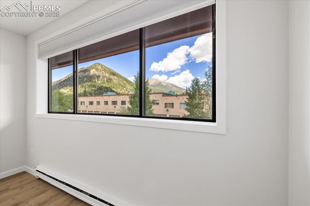 99 Granite Street, Unit 218 Frisco, CO 80443 - Photo 13 of 38 an empty room with wooden floor and a window