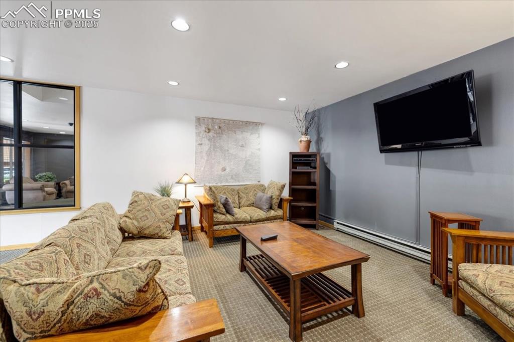 99 Granite Street, Unit 218 Frisco, CO 80443 - Photo 21 of 38 a living room with furniture and a flat screen tv