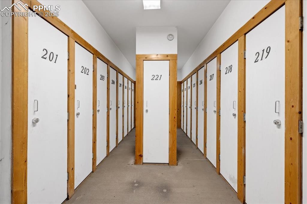 99 Granite Street, Unit 218 Frisco, CO 80443 - Photo 24 of 38 a view of a hallway with wooden stairs