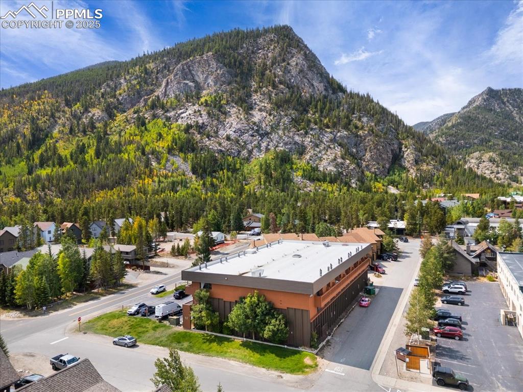 99 Granite Street, Unit 218 Frisco, CO 80443 - Photo 29 of 38 a view of a house with pool and chairs
