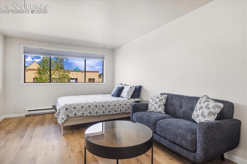 99 Granite Street, Unit 218 Frisco, CO 80443 - Photo 3 of 38 a living room with furniture and a large window