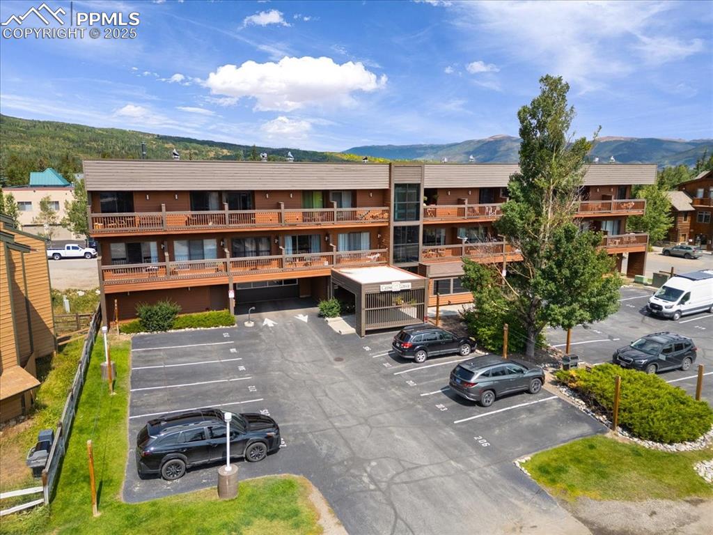 99 Granite Street, Unit 218 Frisco, CO 80443 - Photo 31 of 38 a view of a chairs and table in the back yard of the house
