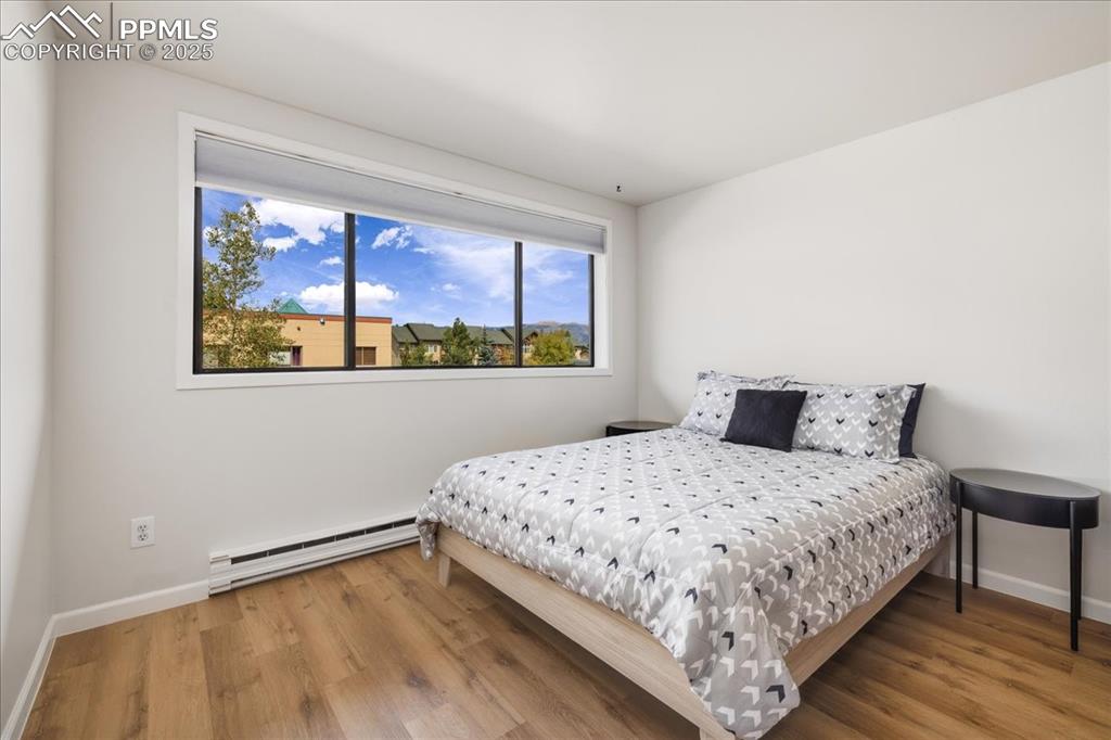 99 Granite Street, Unit 218 Frisco, CO 80443 - Photo 8 of 38 a bedroom with a bed and a window