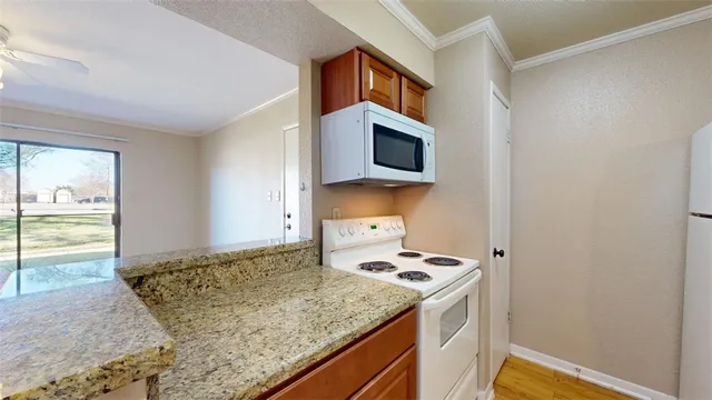 a kitchen with a stove and a microwave