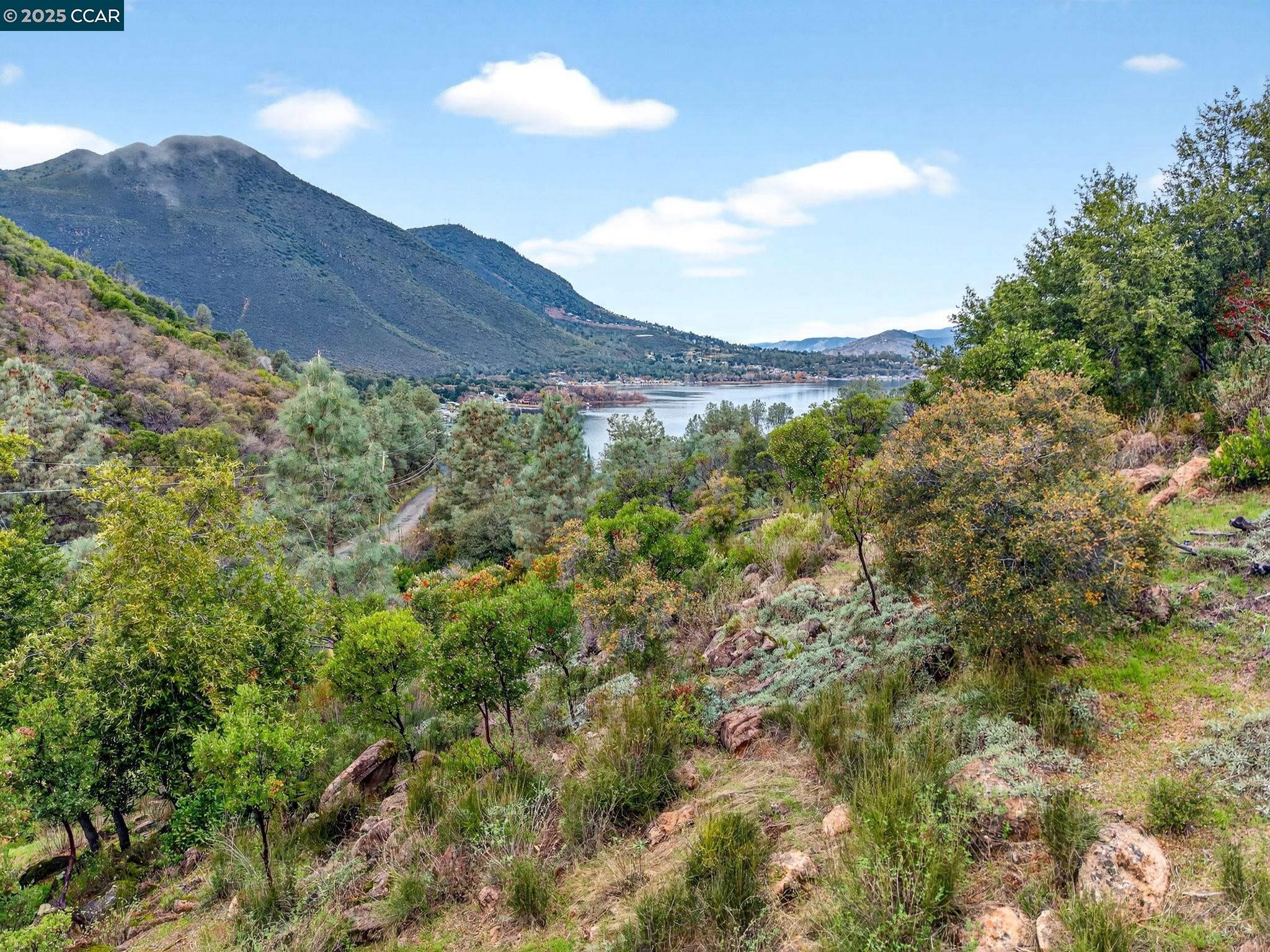 9720 Sequoia Road Kelseyville, CA 95451 - Photo 12 of 15 a view of a dry yard with mountains in the background