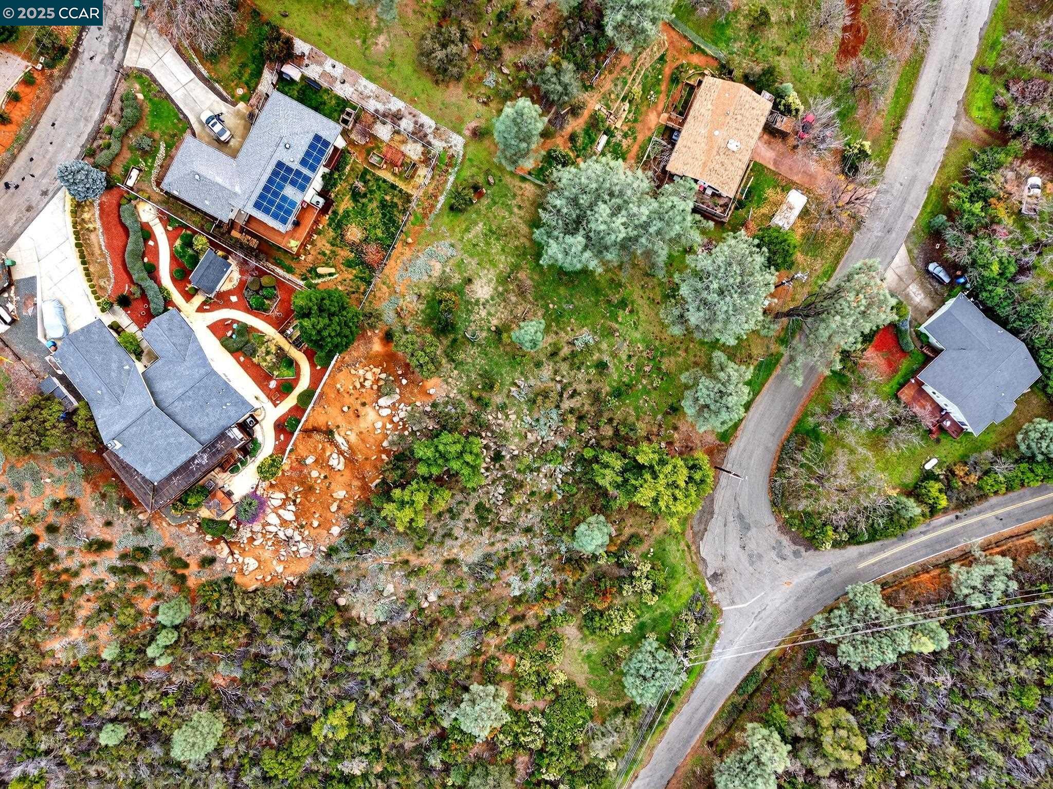 9720 Sequoia Road Kelseyville, CA 95451 - Photo 2 of 15 an aerial view of a house with a yard and wooden fence