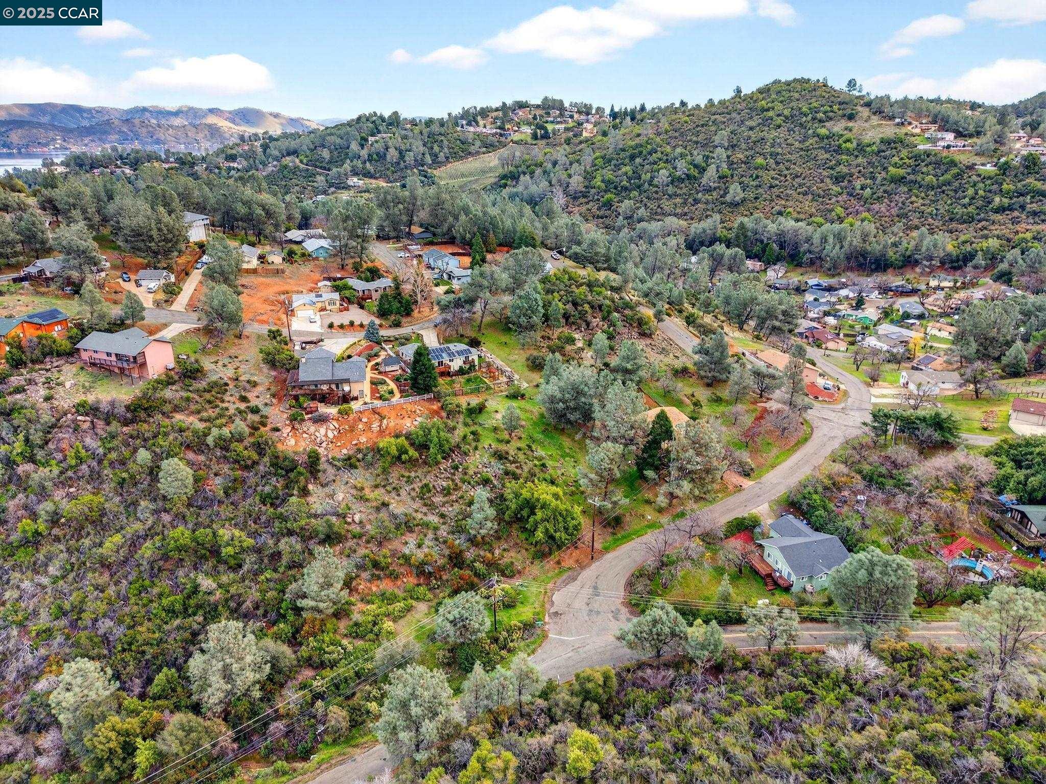 9720 Sequoia Road Kelseyville, CA 95451 - Photo 5 of 15 an aerial view of residential houses with outdoor space and trees