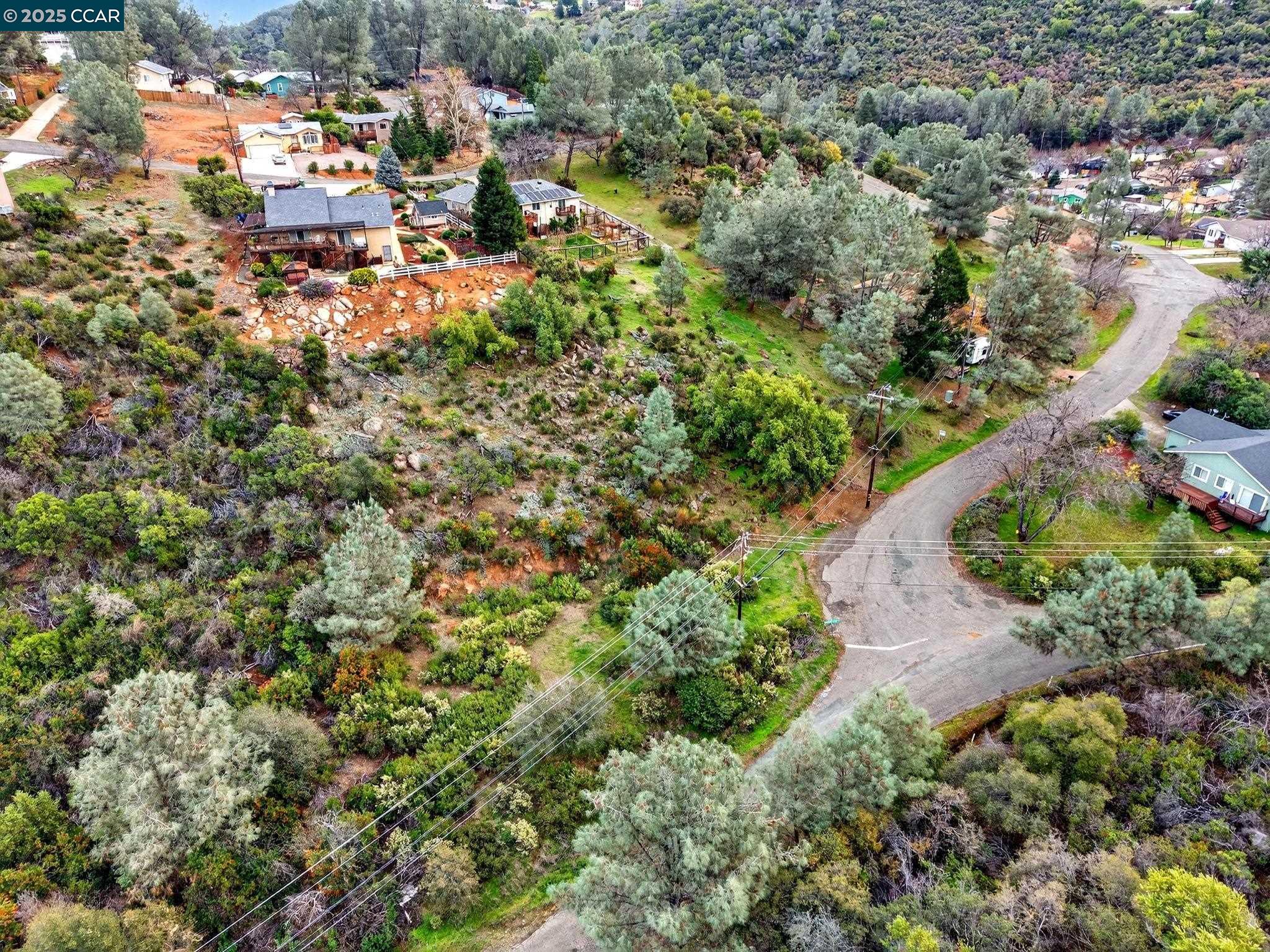 9720 Sequoia Road Kelseyville, CA 95451 - Photo 9 of 15 an aerial view of residential house with outdoor space and trees all around