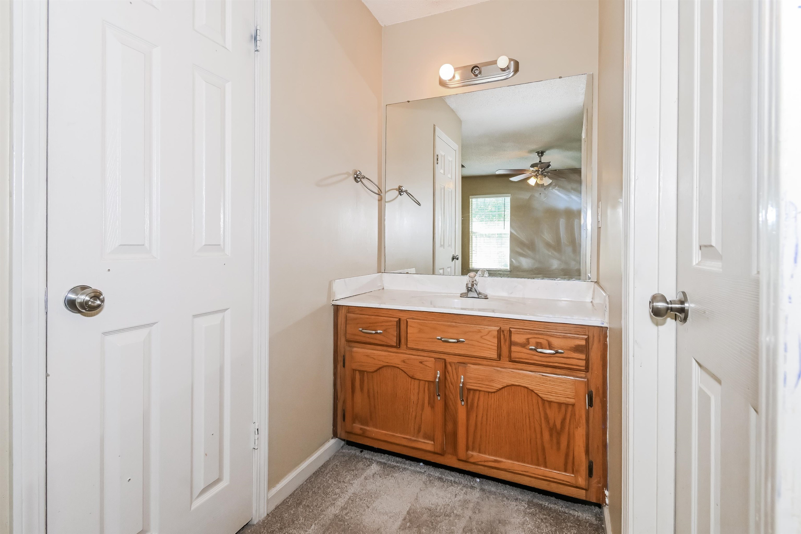 2569 Kate Bond Road Memphis, TN 38133 - Photo 11 of 17 a bathroom with a sink and a mirror