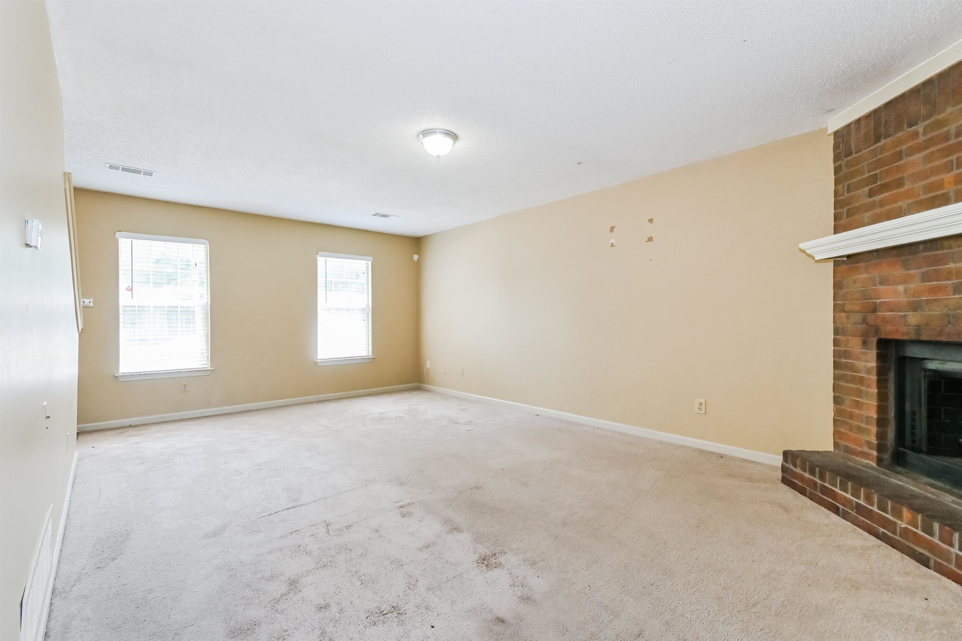 2569 Kate Bond Road Memphis, TN 38133 - Photo 2 of 17 an empty room with windows