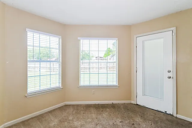 an empty room with windows