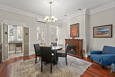 a view of a livingroom with furniture window and wooden floor
