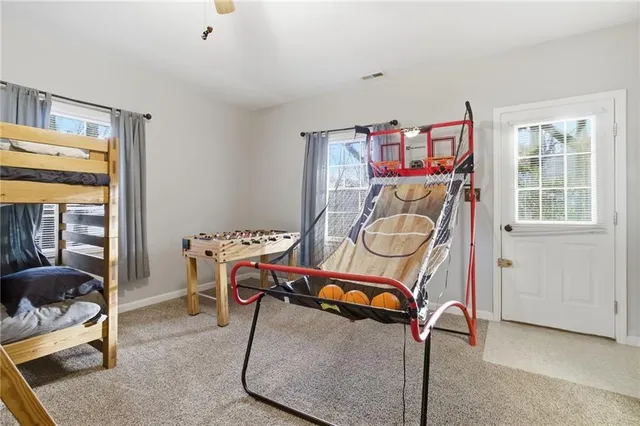 a bed room with a bed and a window