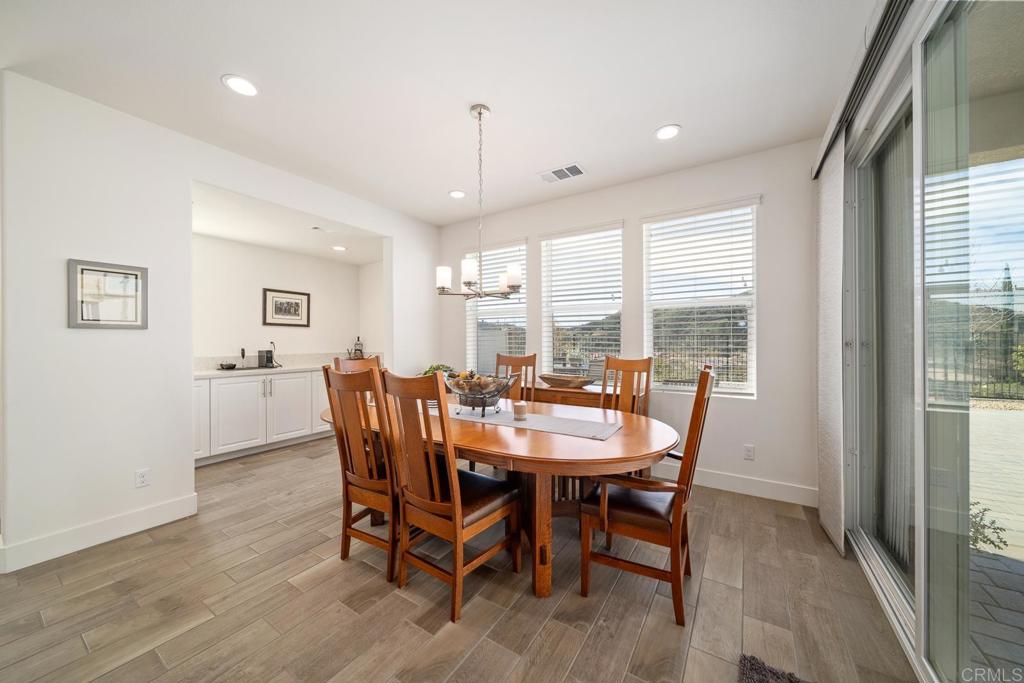 35764 Bay Morgan Lane Fallbrook, CA 92028 - Photo 14 of 69 a view of a dining room with furniture window and wooden floor