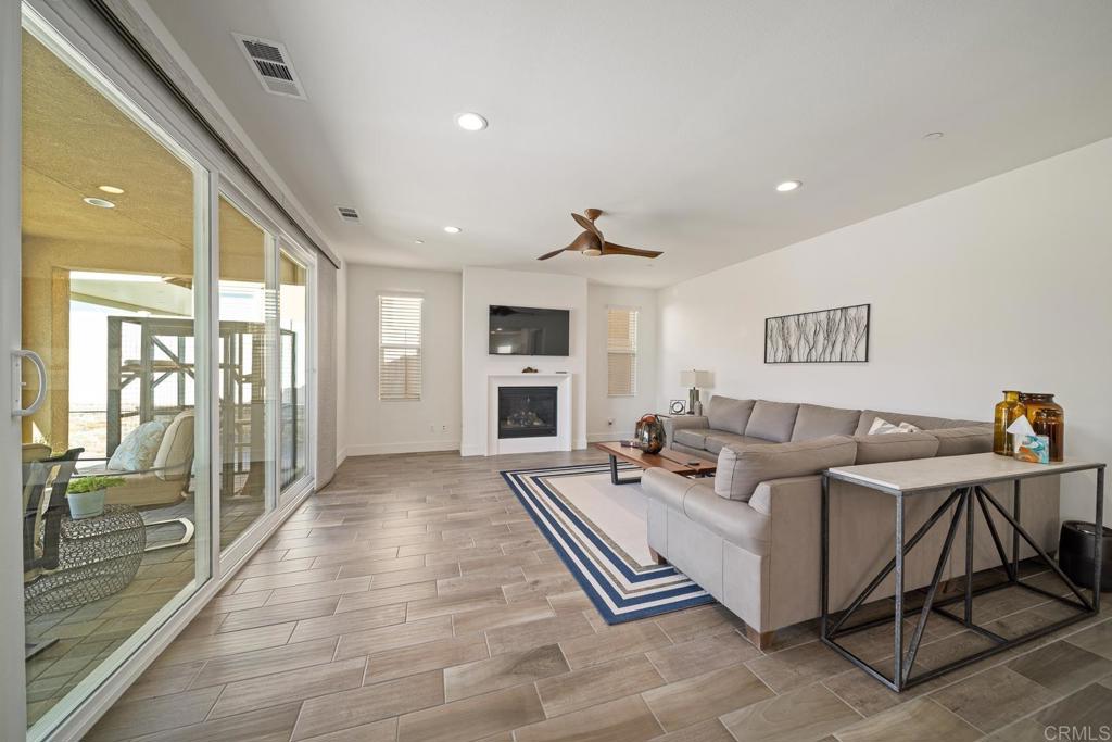 35764 Bay Morgan Lane Fallbrook, CA 92028 - Photo 16 of 69 a living room with furniture a large window and stainless steel appliances