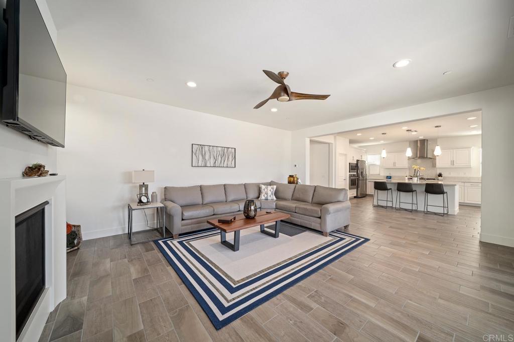 35764 Bay Morgan Lane Fallbrook, CA 92028 - Photo 18 of 69 a living room with furniture a flat screen tv and kitchen view