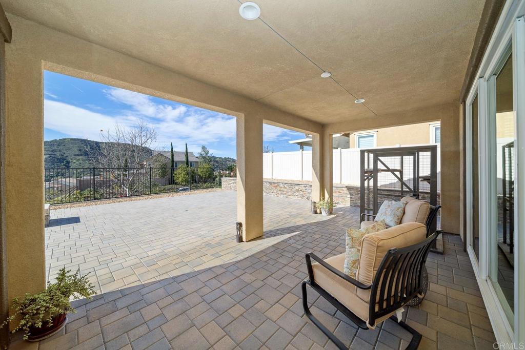 35764 Bay Morgan Lane Fallbrook, CA 92028 - Photo 20 of 69 a living room with furniture and a floor to ceiling window