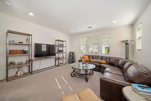 a bedroom with a bed and a potted plant