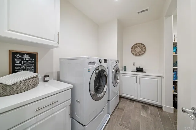 a spacious bathroom with a granite countertop sink mirror and double