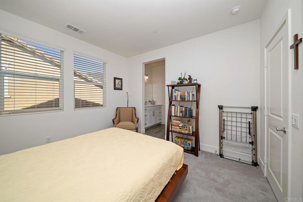 35764 Bay Morgan Lane Fallbrook, CA 92028 - Photo 41 of 69 a bedroom with a bed and a walk in closet